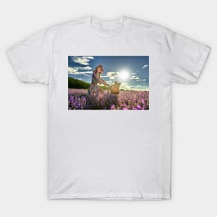 Young woman riding her bicycle in a lavender field T-Shirt